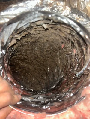 Air duct interior full of dust and debris before cleaning by Air i Am Duct & Chimney Services Houston