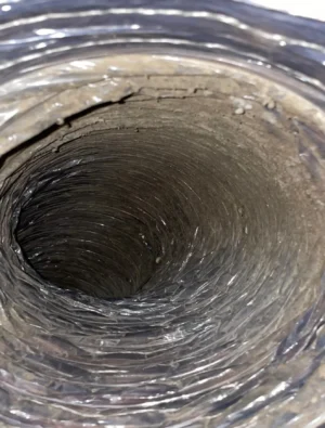 Flexible air duct full of dust before cleaning by Air i Am Duct & Chimney Services Houston