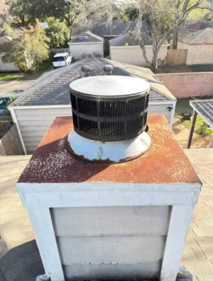 Dirty chimney cap and top before cleaning by Air i Am Duct & Chimney Services Houston